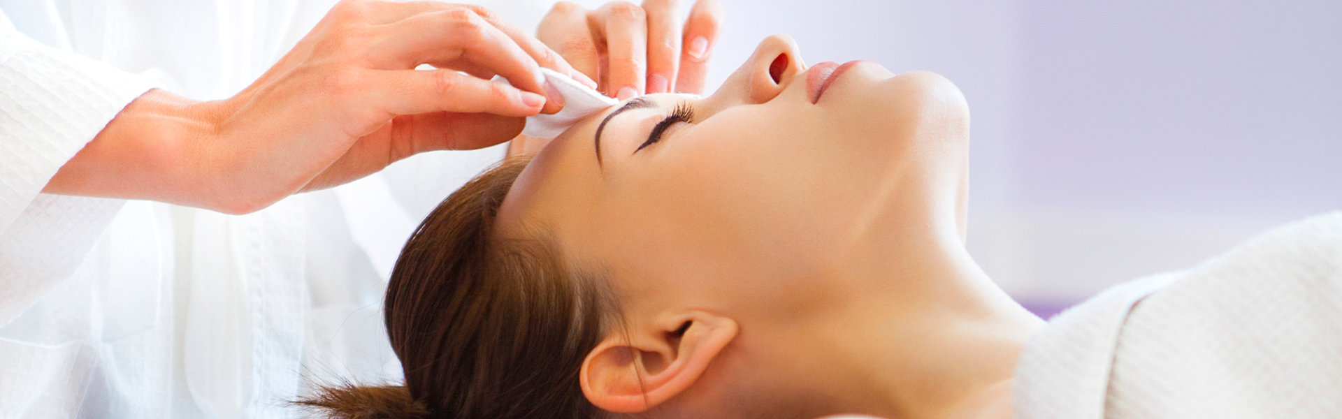 woman receivng facial treatment